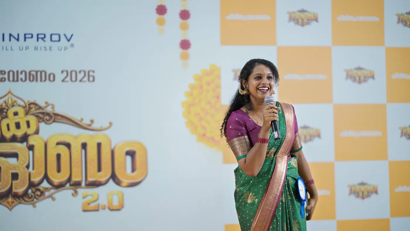 A host on stage at a Finprov event